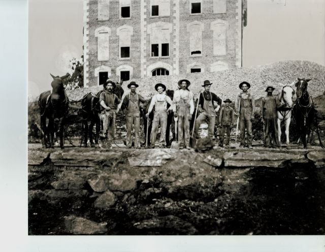 Photograph of laborers with mules
